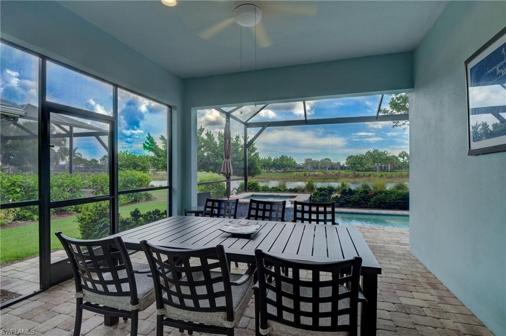 5708 Highbourne Drive Naples, FL 34113 - Photo 12 of 28 a view of a patio with a table chairs and a table
