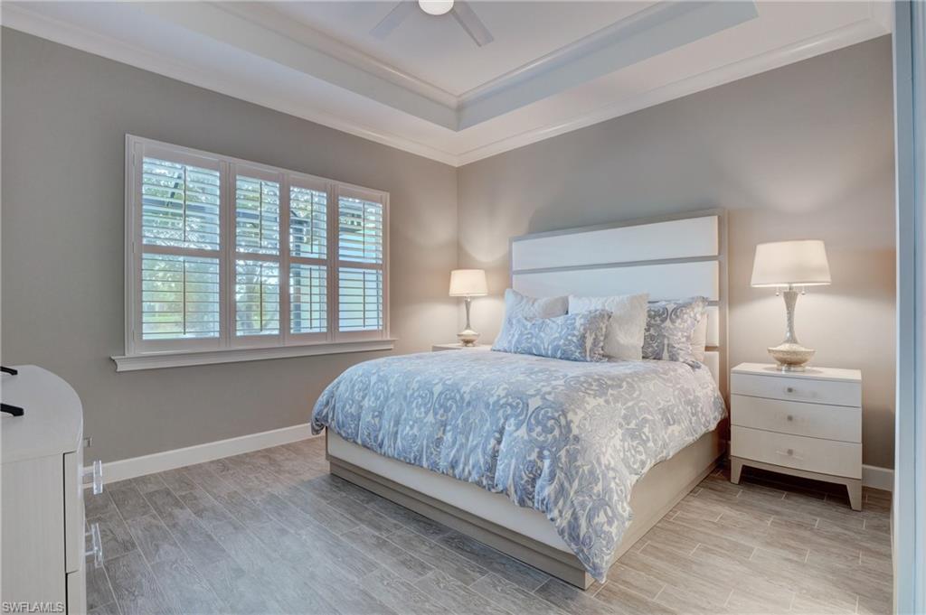 5708 Highbourne Drive Naples, FL 34113 - Photo 13 of 28 a bedroom with a bed and a window