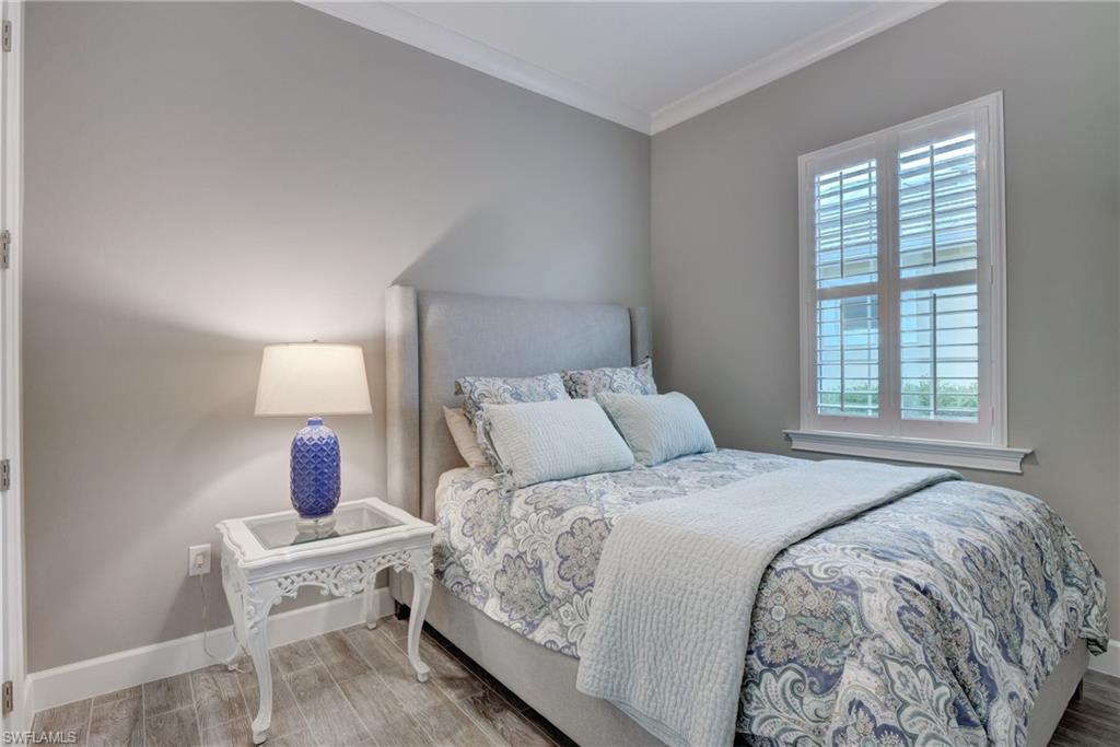 5708 Highbourne Drive Naples, FL 34113 - Photo 16 of 28 a bedroom with a bed and a window