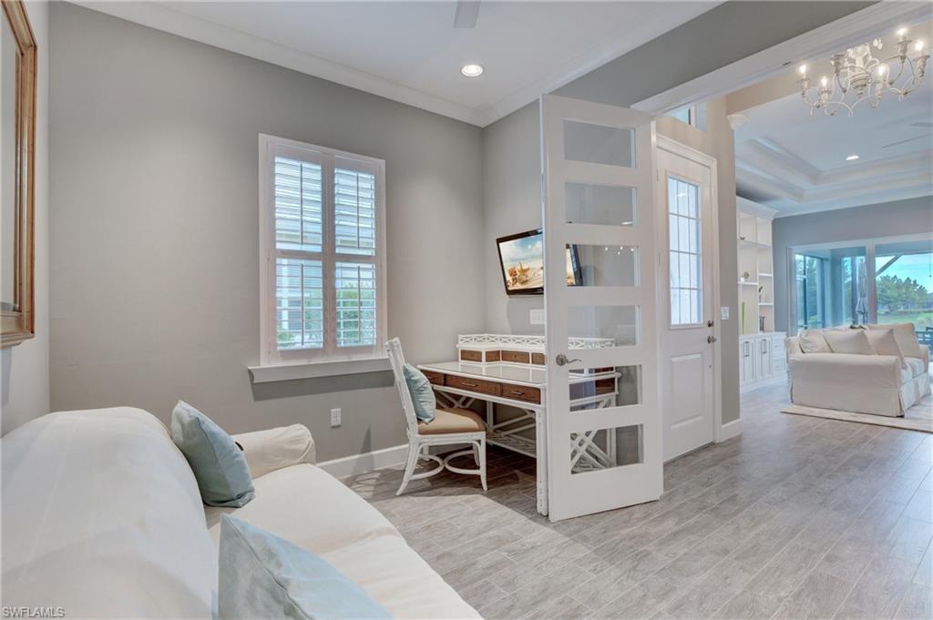 5708 Highbourne Drive Naples, FL 34113 - Photo 18 of 28 a bed room with a bed and a view of en suite bathroom