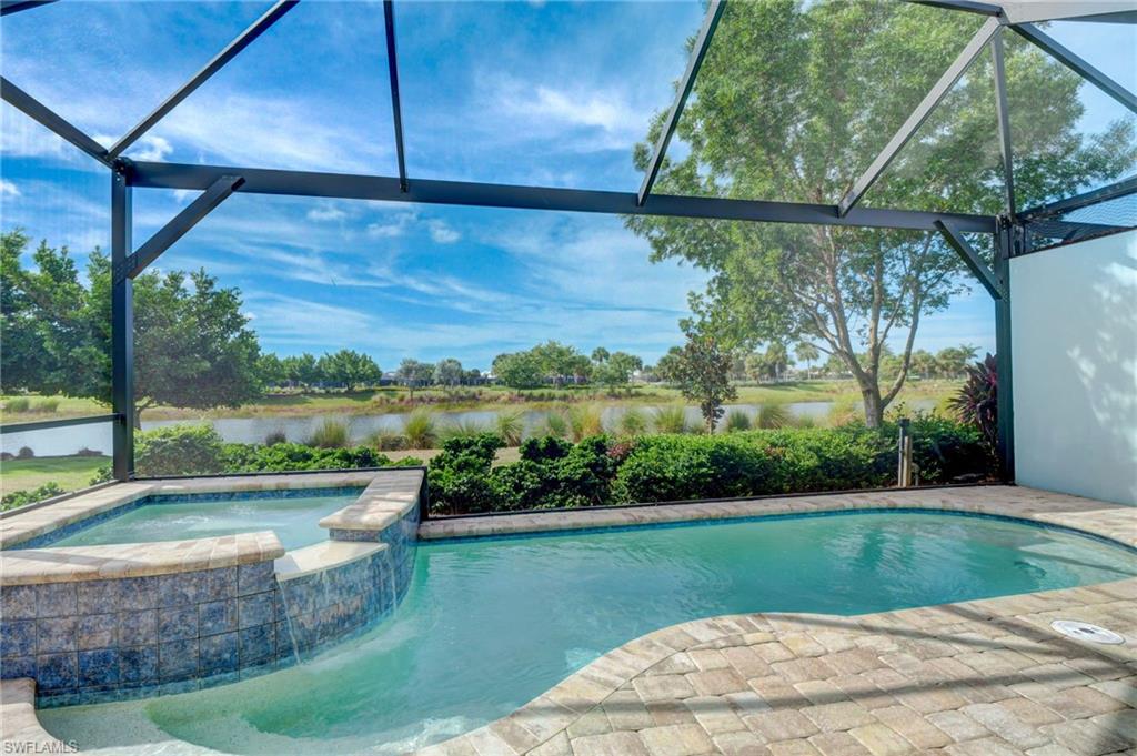 5708 Highbourne Drive Naples, FL 34113 - Photo 2 of 28 a view of a swimming pool with a patio