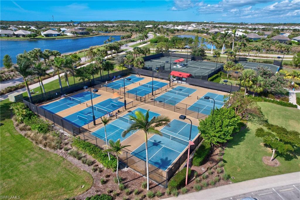 5708 Highbourne Drive Naples, FL 34113 - Photo 21 of 28 an aerial view of a houses with a lake view