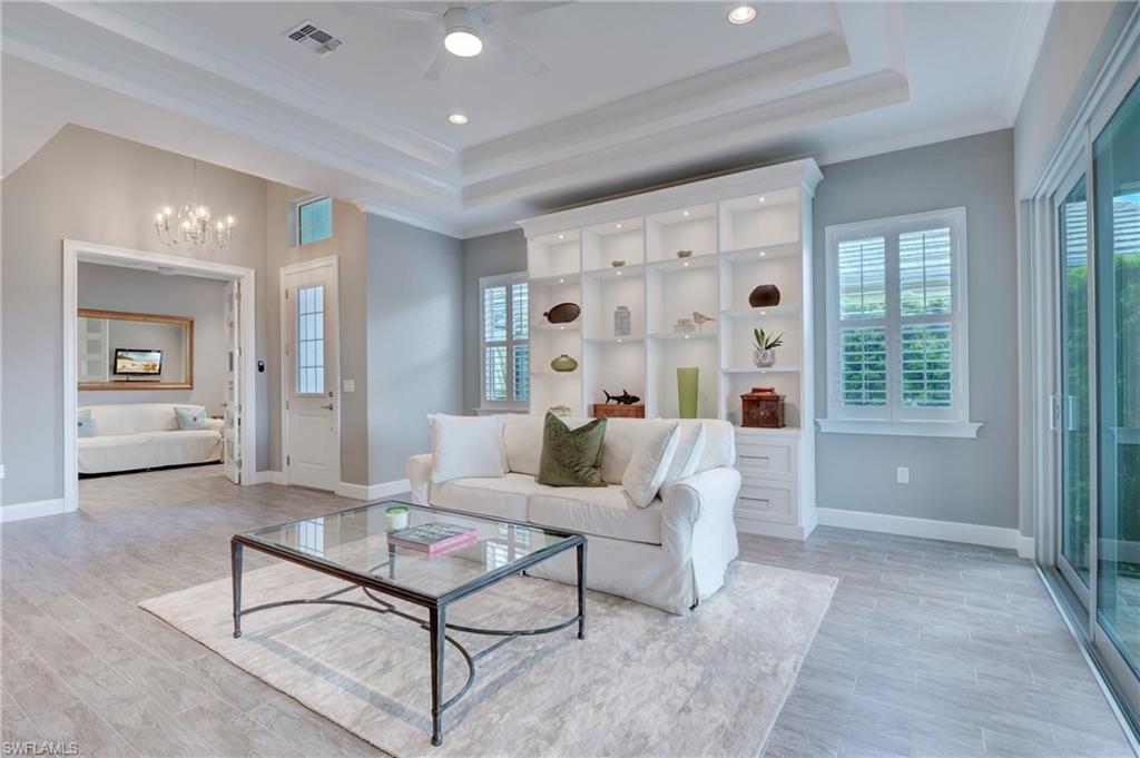 5708 Highbourne Drive Naples, FL 34113 - Photo 4 of 28 a living room with furniture and a large window