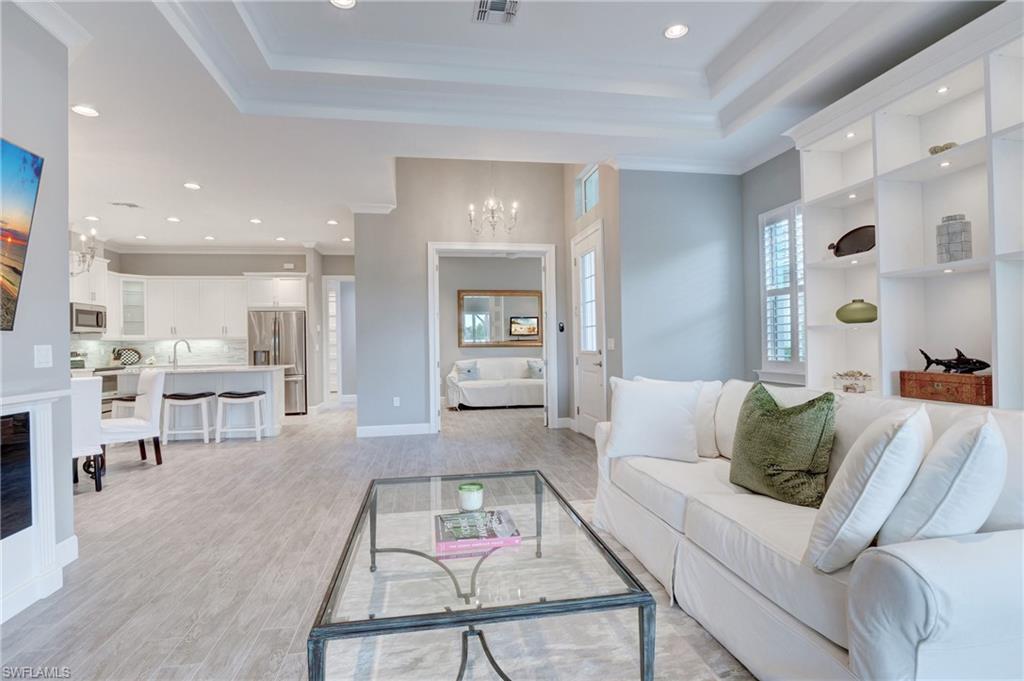 5708 Highbourne Drive Naples, FL 34113 - Photo 5 of 28 a living room with furniture and a table