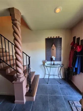 a view of a hallway view with wooden floor and staircase