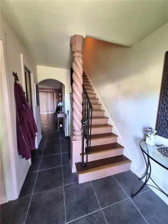 a bedroom with a bed and a tv