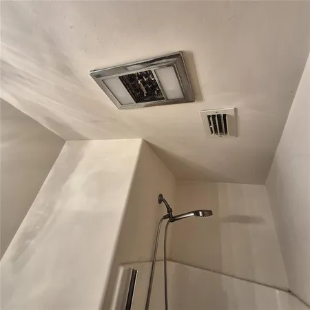 a view of grassy field with grass and trees