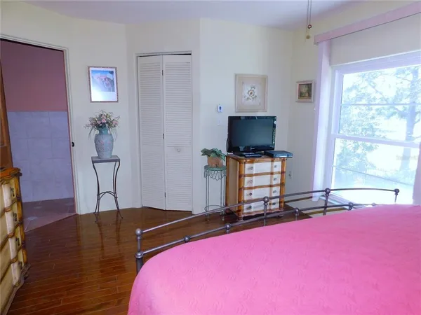 a sign that is sitting in the grass near a yard