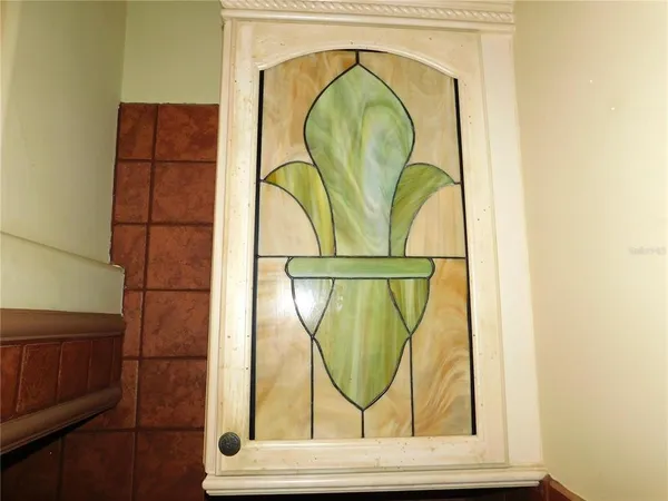 a kitchen with stainless steel appliances a sink stove and cabinets