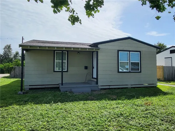 a view of front door and yard