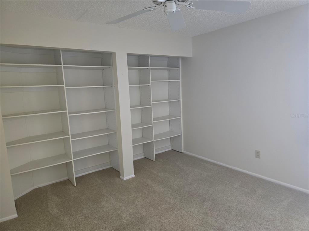 411 South Bayshore Boulevard, Unit 1 Safety Harbor, FL 34695 - Photo 14 of 30 a view of an empty room with empty shelves