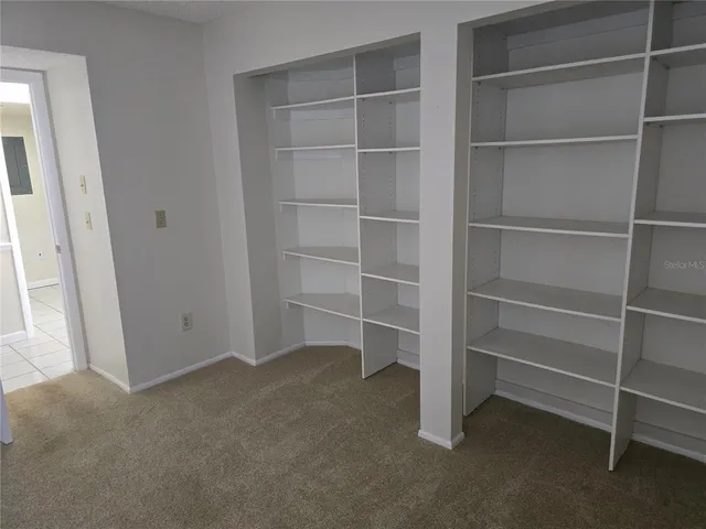 a view of an empty room with empty racks
