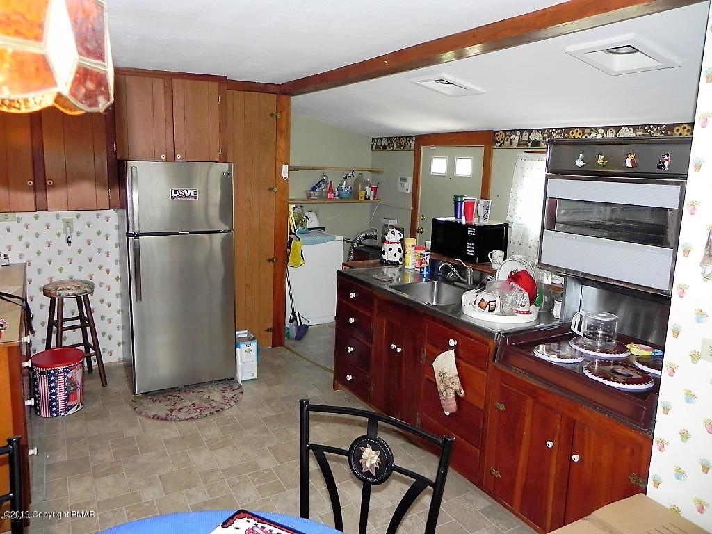 522 Kunkletown Road Kunkletown, PA 18058 - Photo 4 of 15 a kitchen with stainless steel appliances granite countertop a refrigerator and a stove