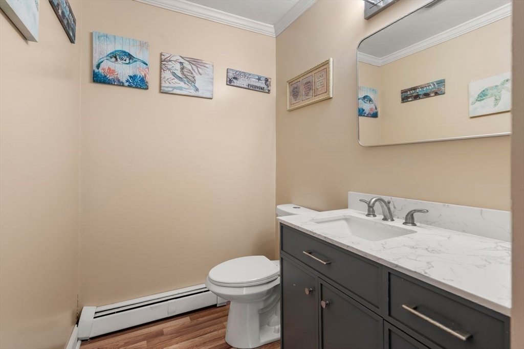 231 Lapham Street Fall River, MA 02721 - Photo 11 of 20 a bathroom with a granite countertop toilet and a sink
