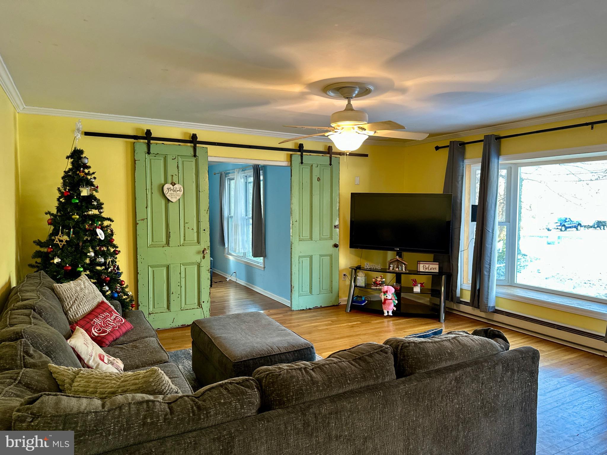 3675 Seaman Road Preston, MD 21655 - Photo 18 of 35 a living room with furniture and a flat screen tv