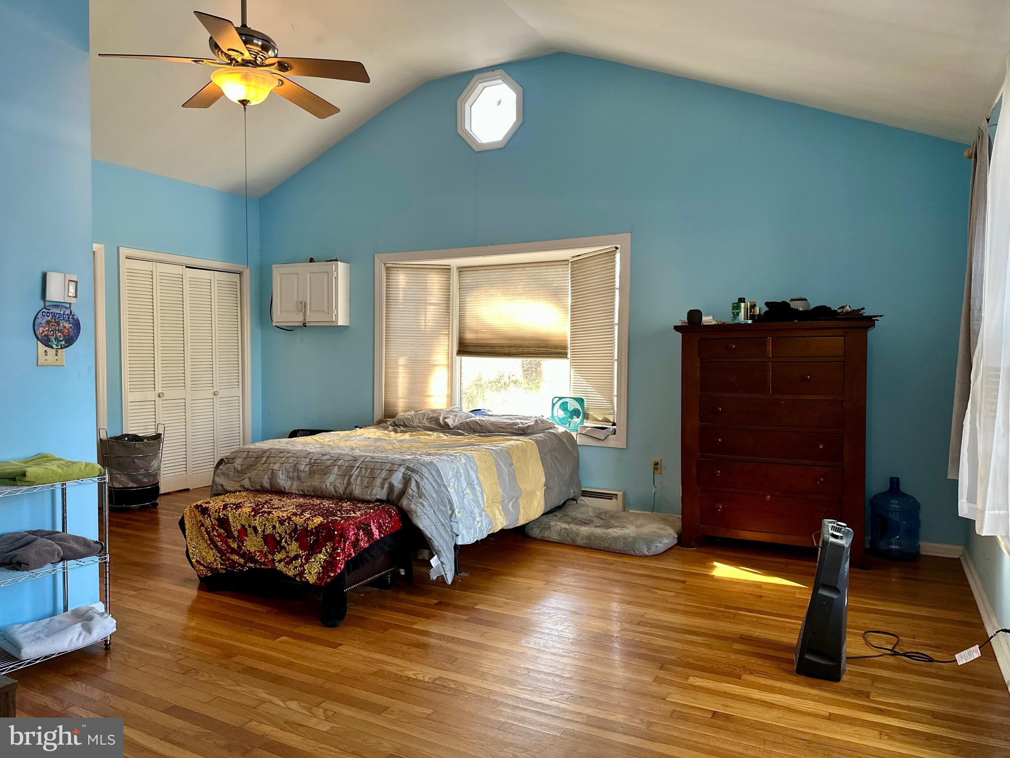 3675 Seaman Road Preston, MD 21655 - Photo 19 of 35 a bedroom with a bed and a chandelier