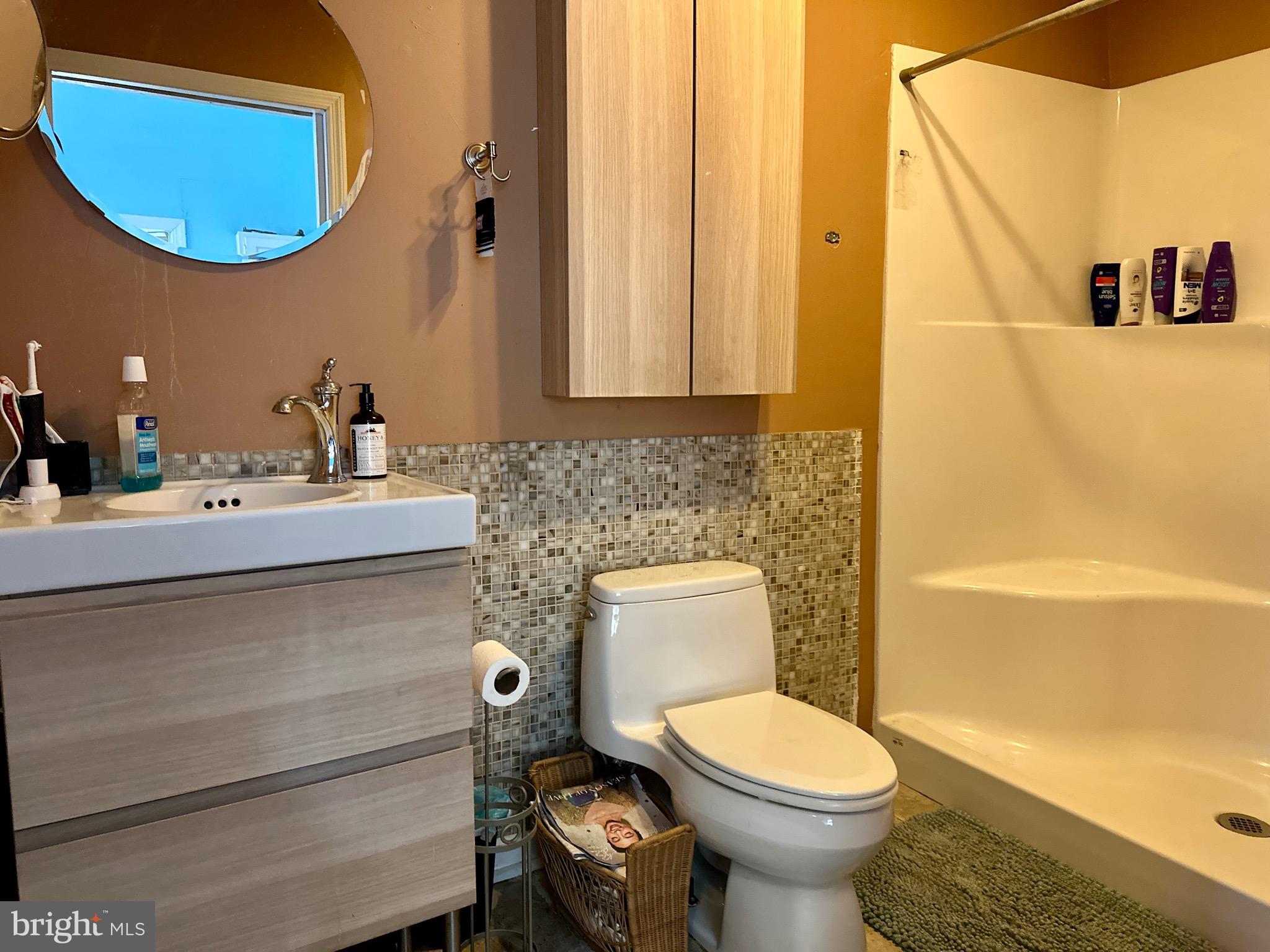 3675 Seaman Road Preston, MD 21655 - Photo 24 of 35 a bathroom with a toilet sink and mirror