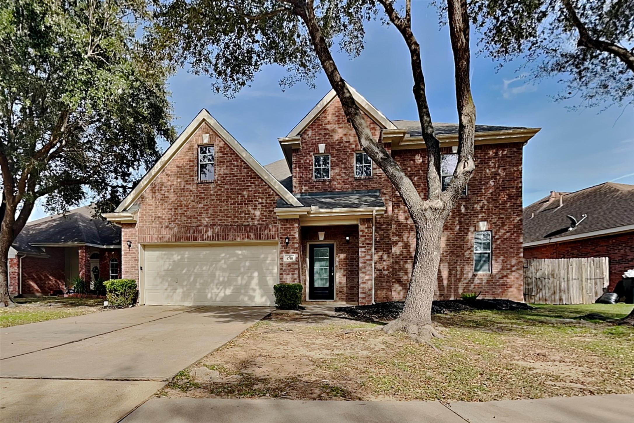 4718 Wild Bluebonnet Way Houston, TX 77084 - Photo 1 of 20 a front view of a house with garden