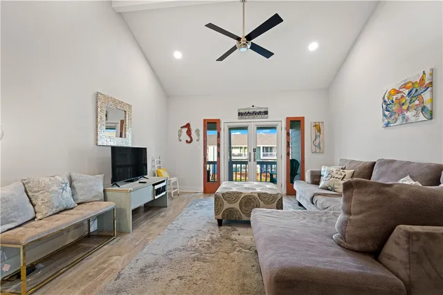 a view of a balcony with dining table and chairs with wooden floor