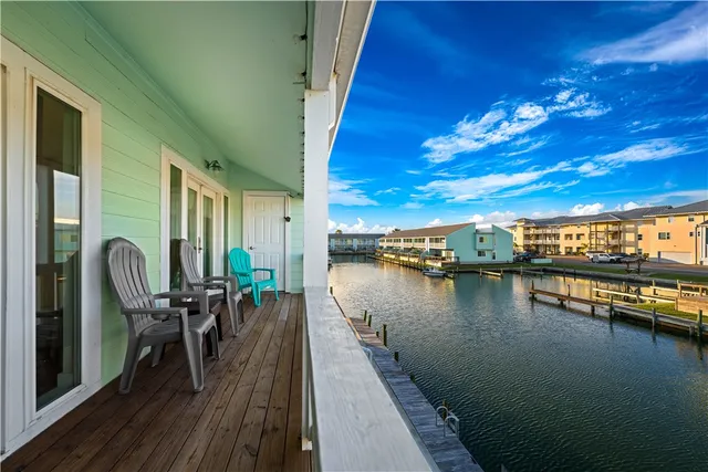 a view of a balcony with chairs