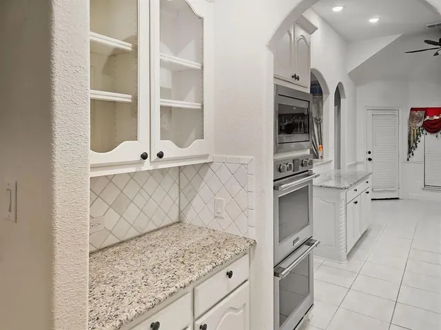 a view of cabinets a washer and dryer