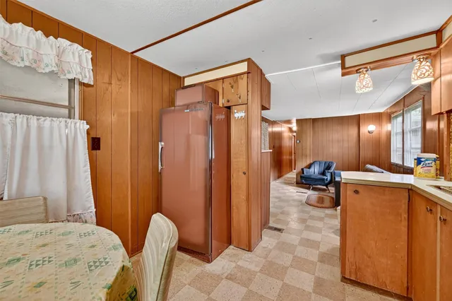 a bedroom with a bed and a furniture