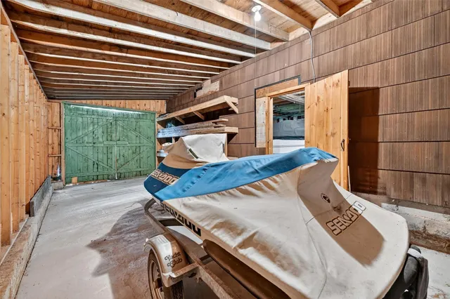 a view of a patio with table and chairs with wooden floor and fence
