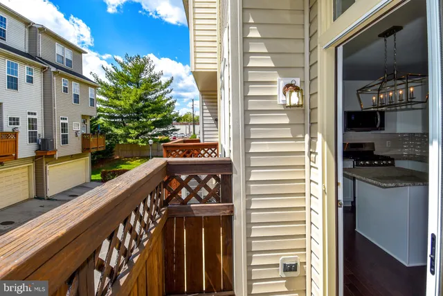 a view of a balcony a stove and furniture
