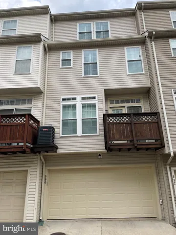 a view of a brick house with many windows