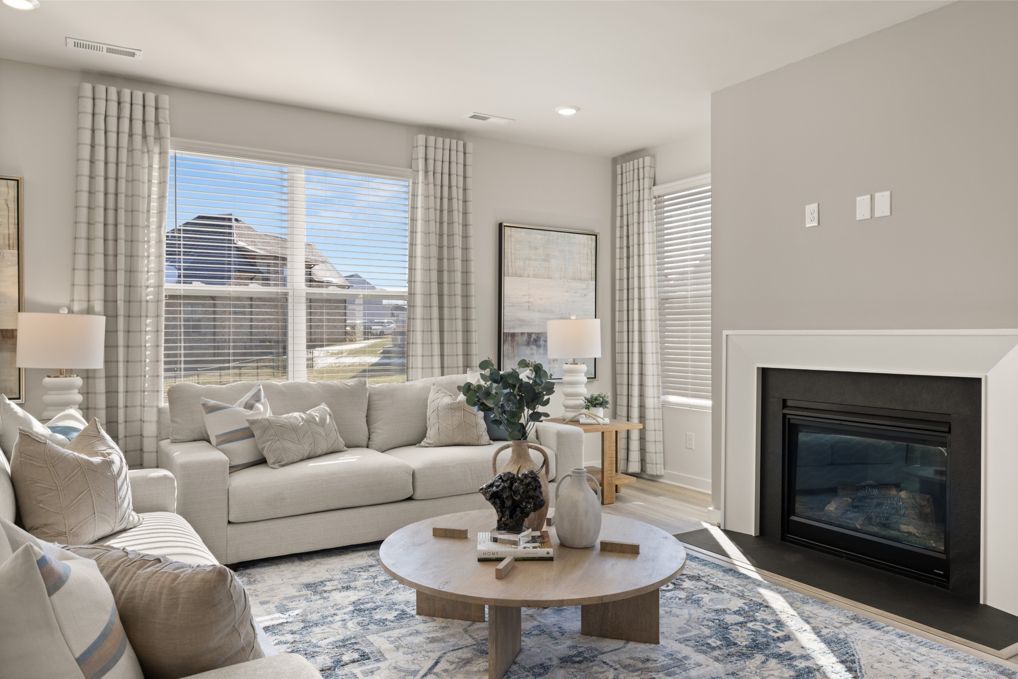 1517 Cherry Tree Lane Mount Juliet, TN 37122 - Photo 21 of 56 a living room with furniture a fireplace and a table