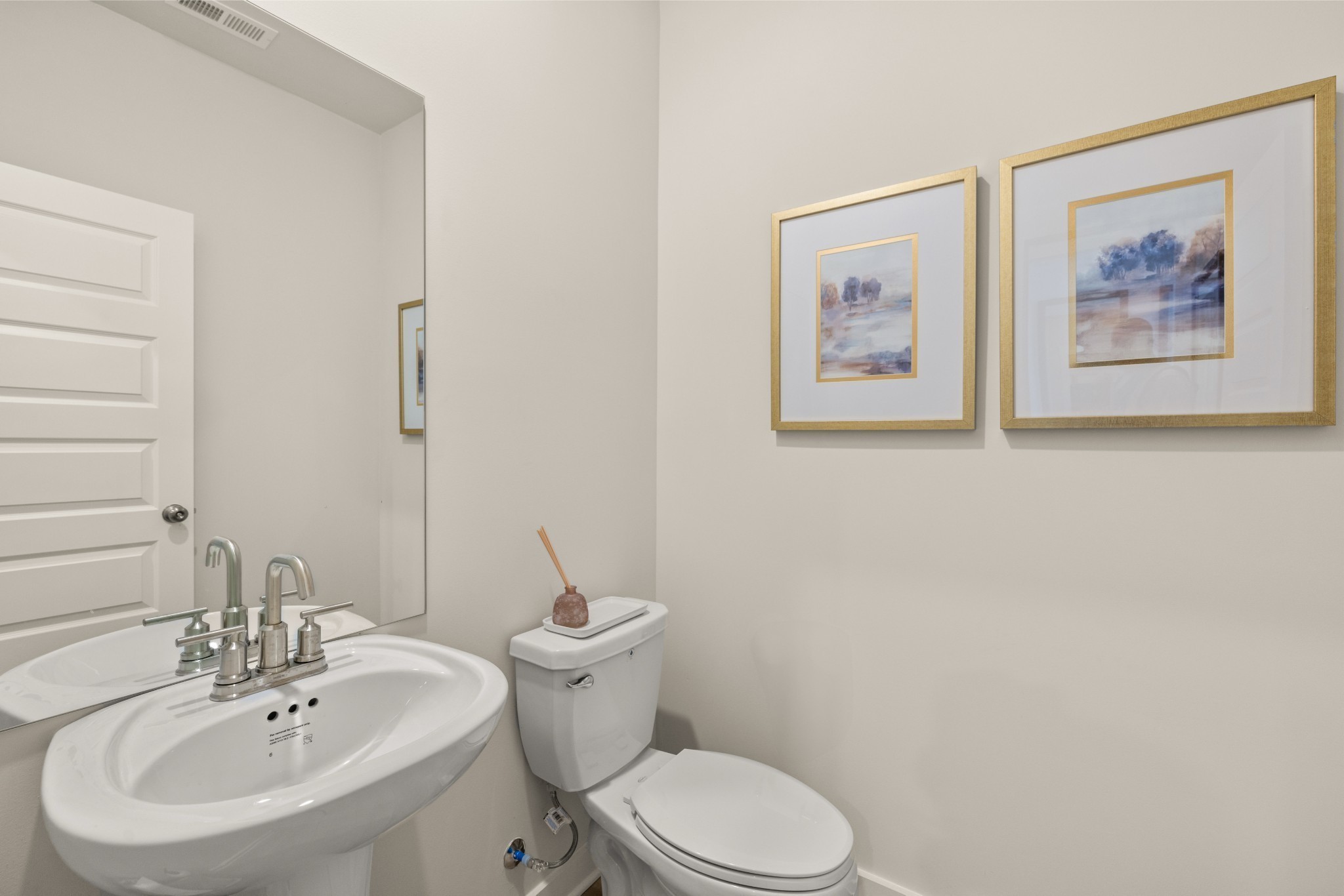 1517 Cherry Tree Lane Mount Juliet, TN 37122 - Photo 26 of 56 a bathroom with a toilet sink and mirror