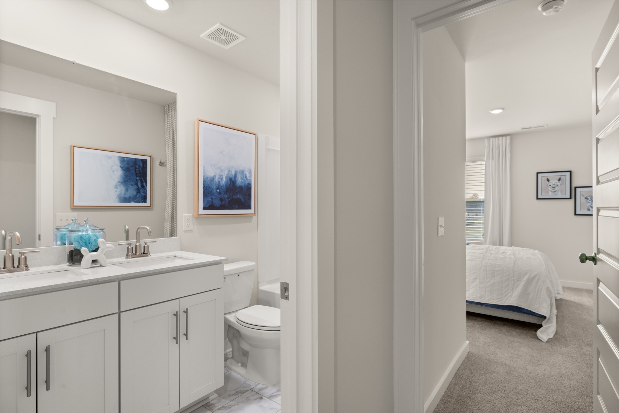 1517 Cherry Tree Lane Mount Juliet, TN 37122 - Photo 43 of 56 a en suite bathroom with a double vanity sink a mirror and a toilet