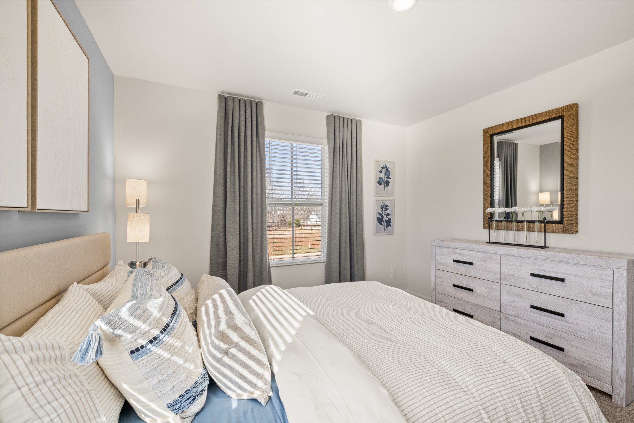 1517 Cherry Tree Lane Mount Juliet, TN 37122 - Photo 46 of 56 a bedroom with a bed and a dresser