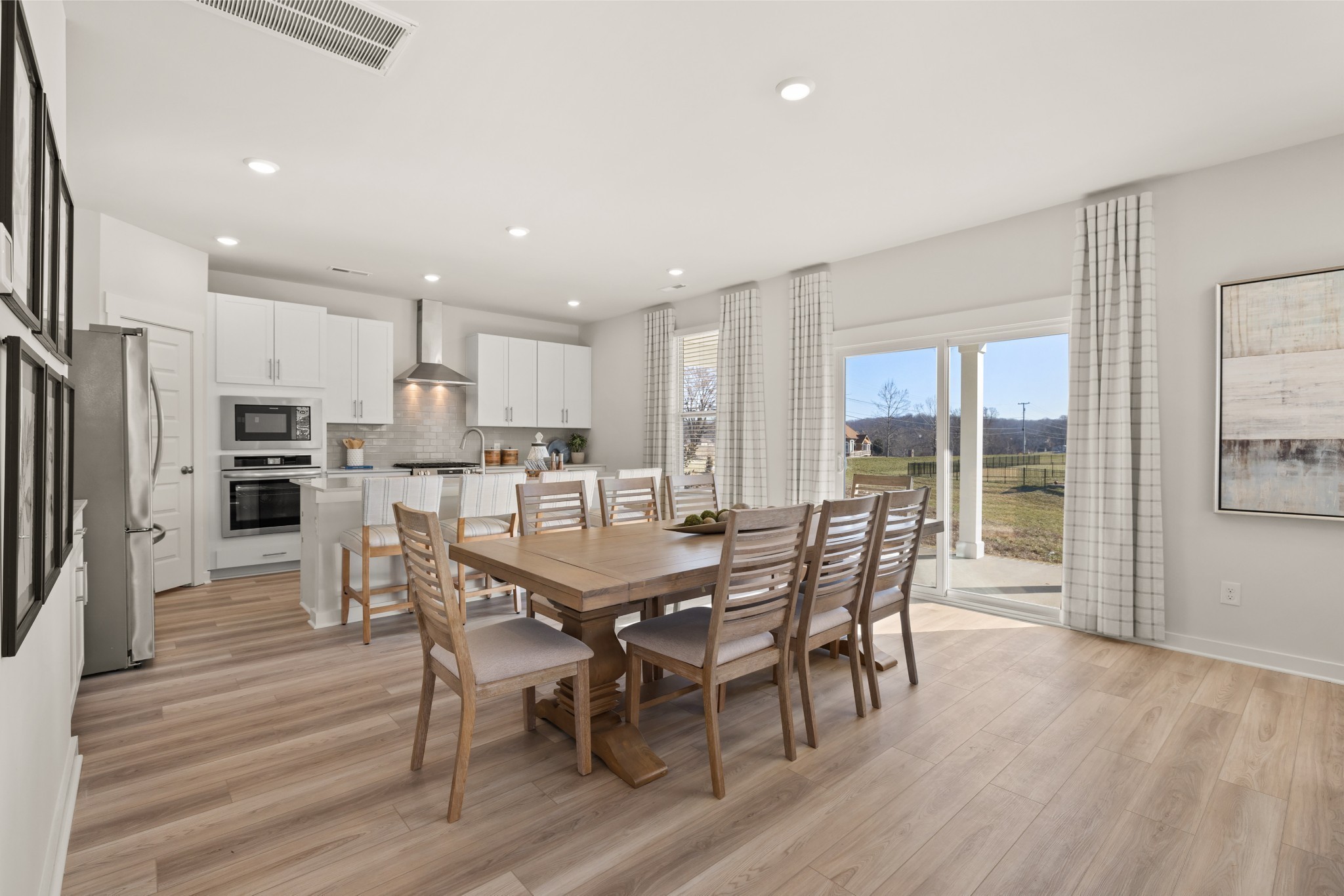 1517 Cherry Tree Lane Mount Juliet, TN 37122 - Photo 6 of 56 a view of a dining room with furniture a rug and wooden floor
