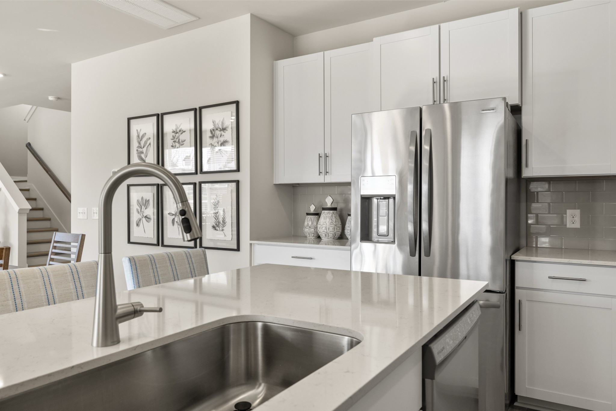 1517 Cherry Tree Lane Mount Juliet, TN 37122 - Photo 10 of 56 a kitchen with stainless steel appliances granite countertop a refrigerator a sink and white cabinets with wooden floors