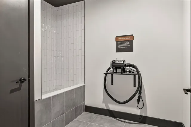 a bathroom with a mirror and a shower