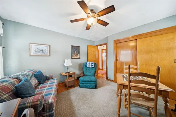 a living room with furniture and large windows
