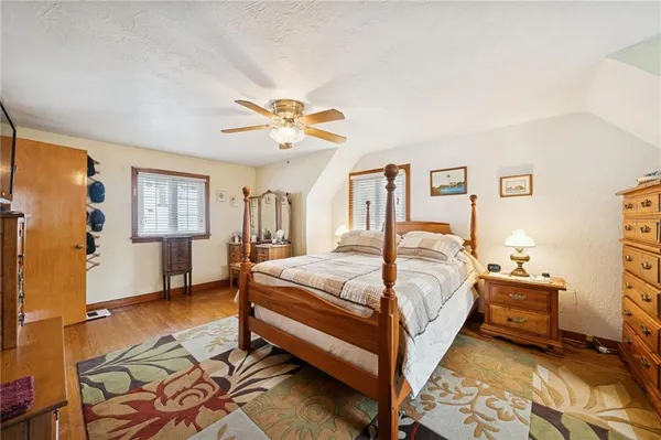 a bed room with a bed and a chandelier