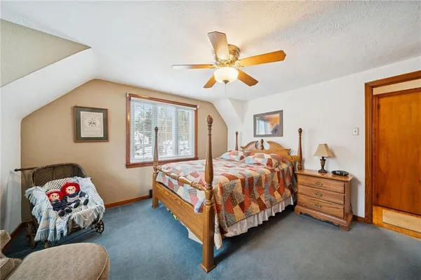 a bed room with a bed and a window