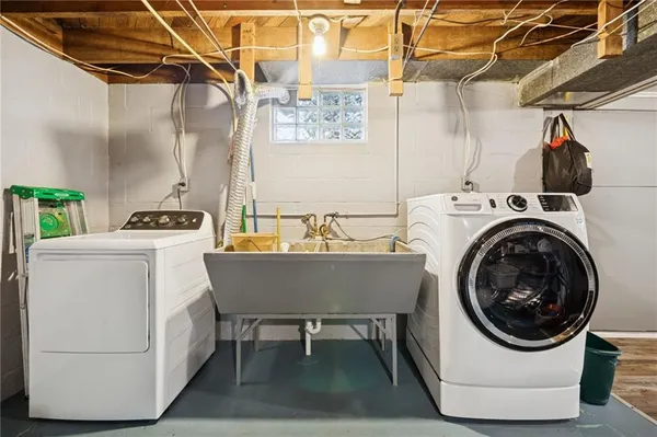 a utility room with dryer and washer