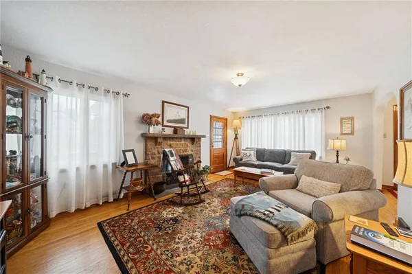a living room with furniture rug and window