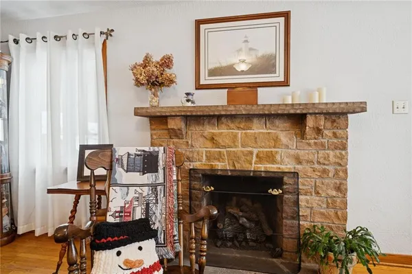 a room with fireplace and wooden floor