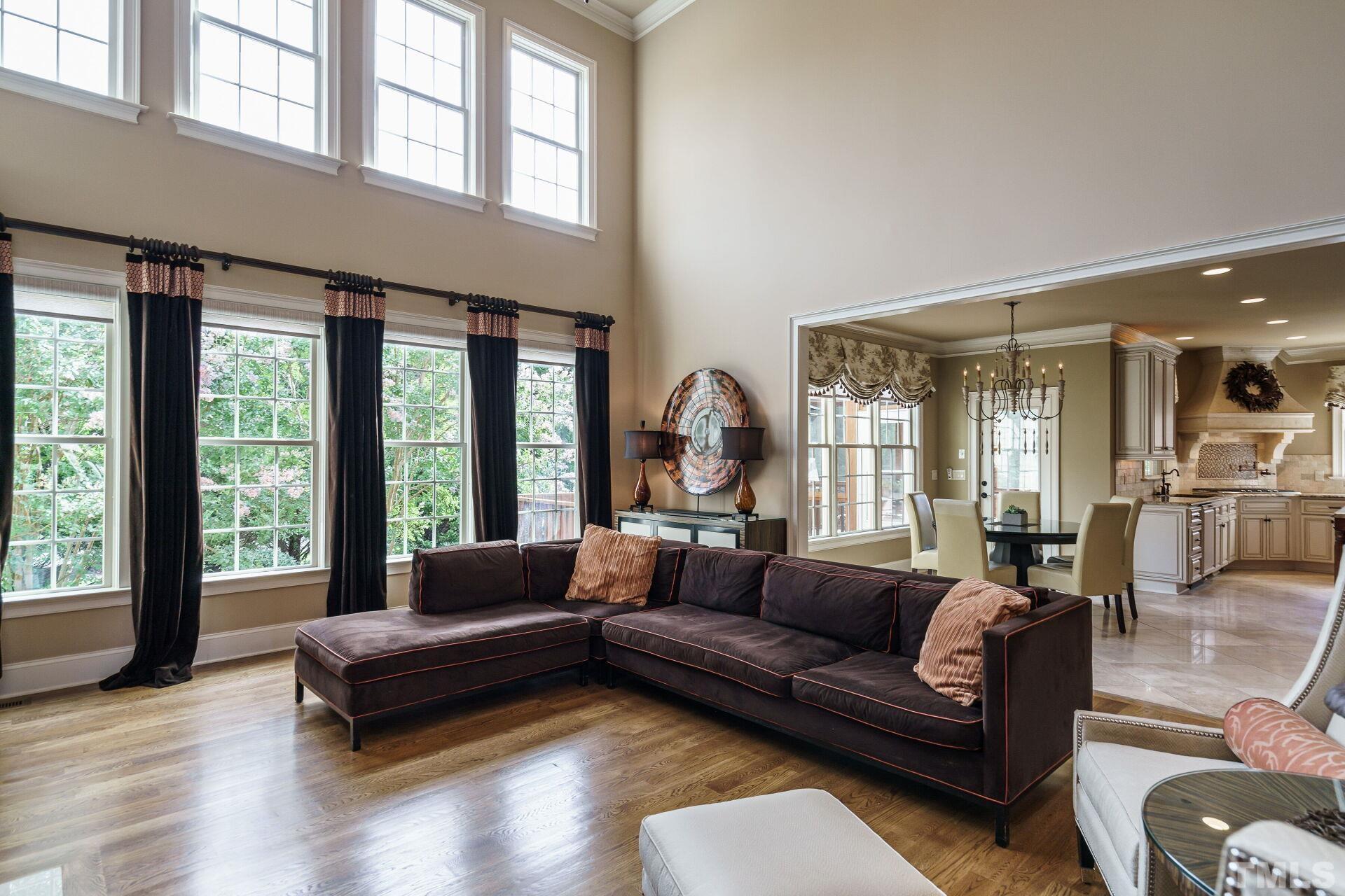 8313 Rue Cassini Court Raleigh, NC 27615 - Photo 11 of 74 a living room with furniture and a large window