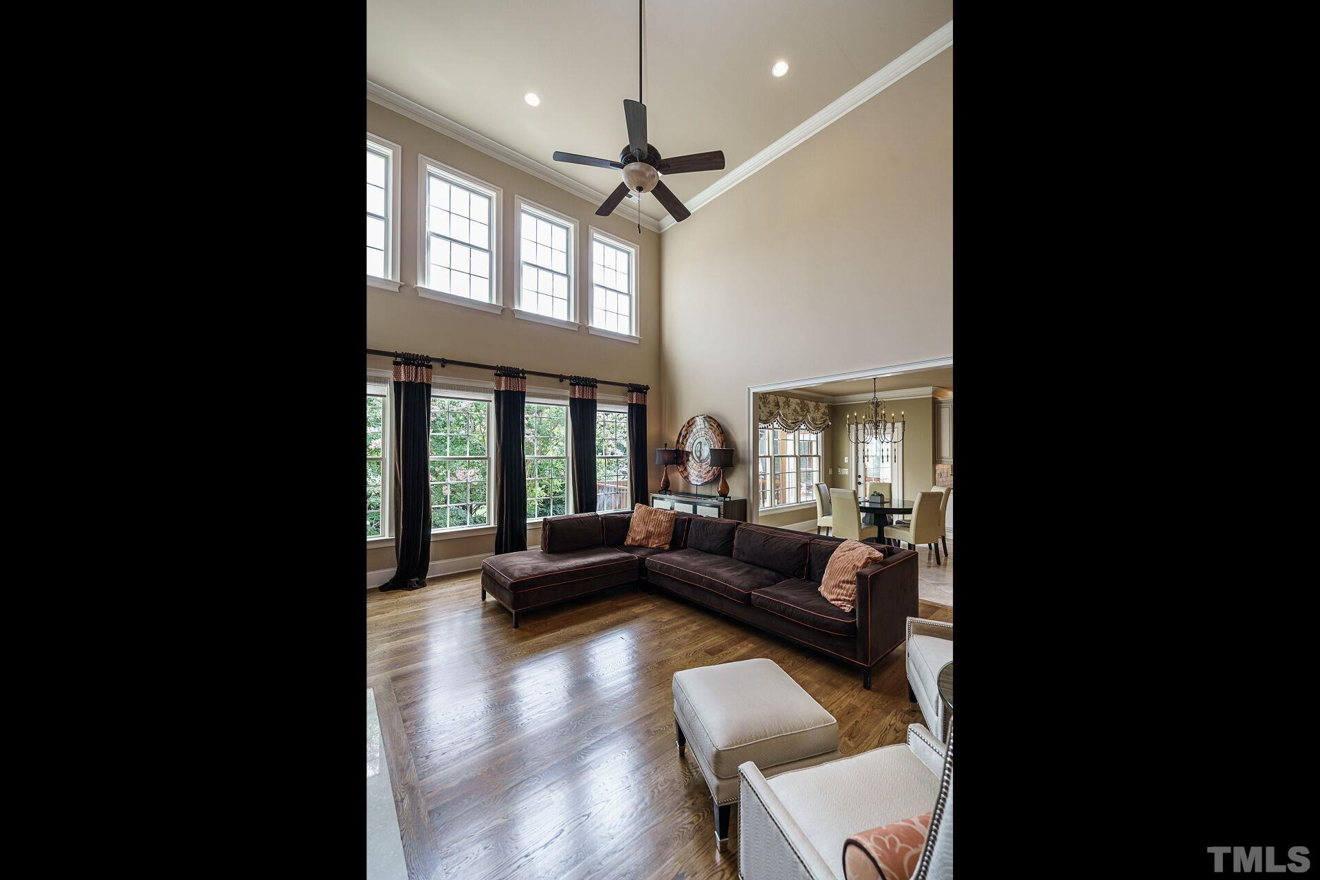 8313 Rue Cassini Court Raleigh, NC 27615 - Photo 15 of 74 a living room with furniture and a large window
