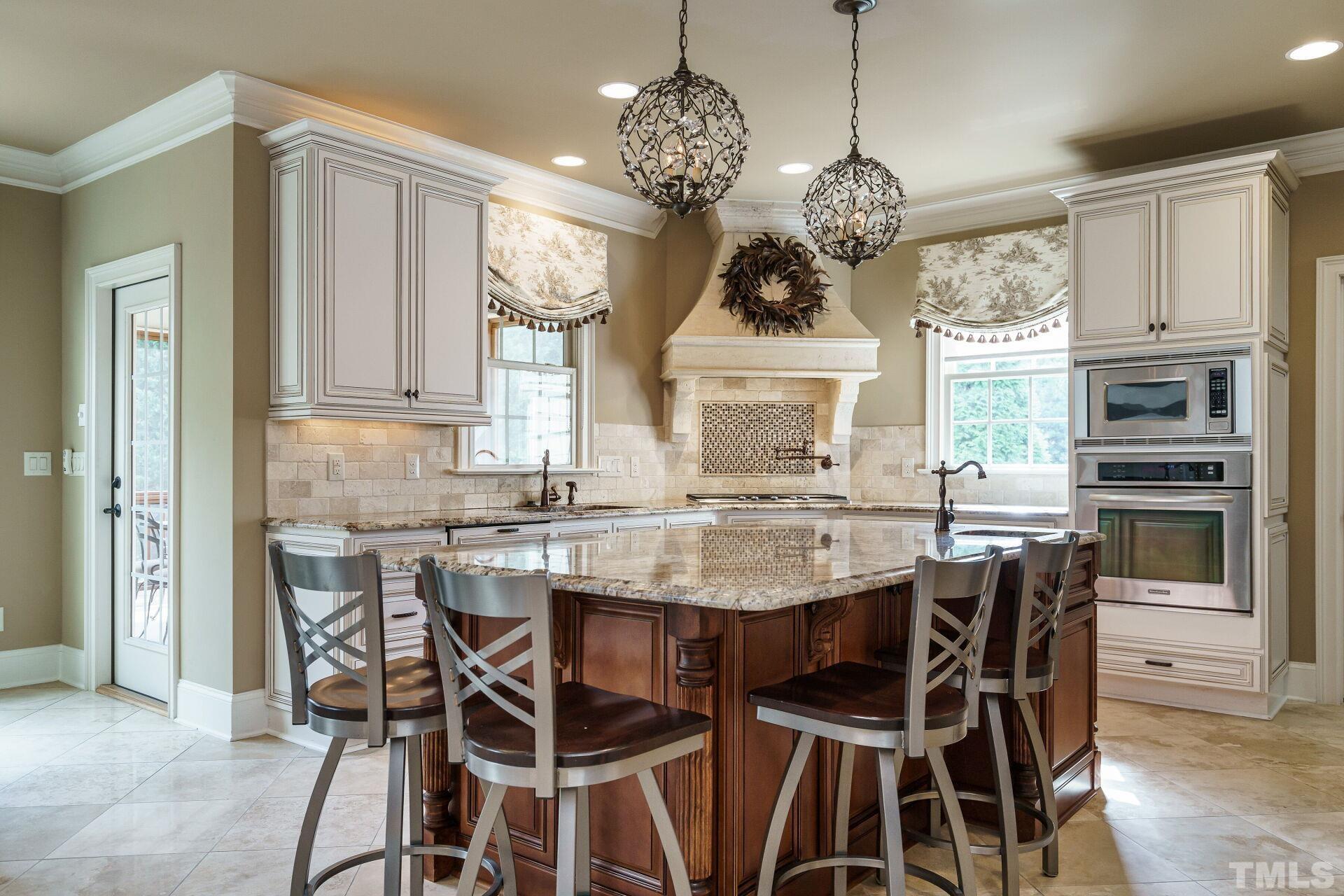 8313 Rue Cassini Court Raleigh, NC 27615 - Photo 18 of 74 a view of a dining room with furniture window and wooden floor