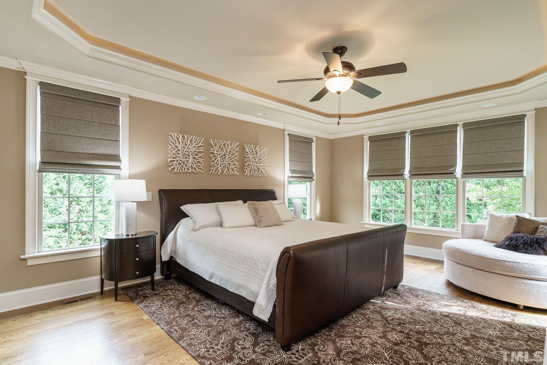8313 Rue Cassini Court Raleigh, NC 27615 - Photo 23 of 74 a bedroom with a bed and a couch