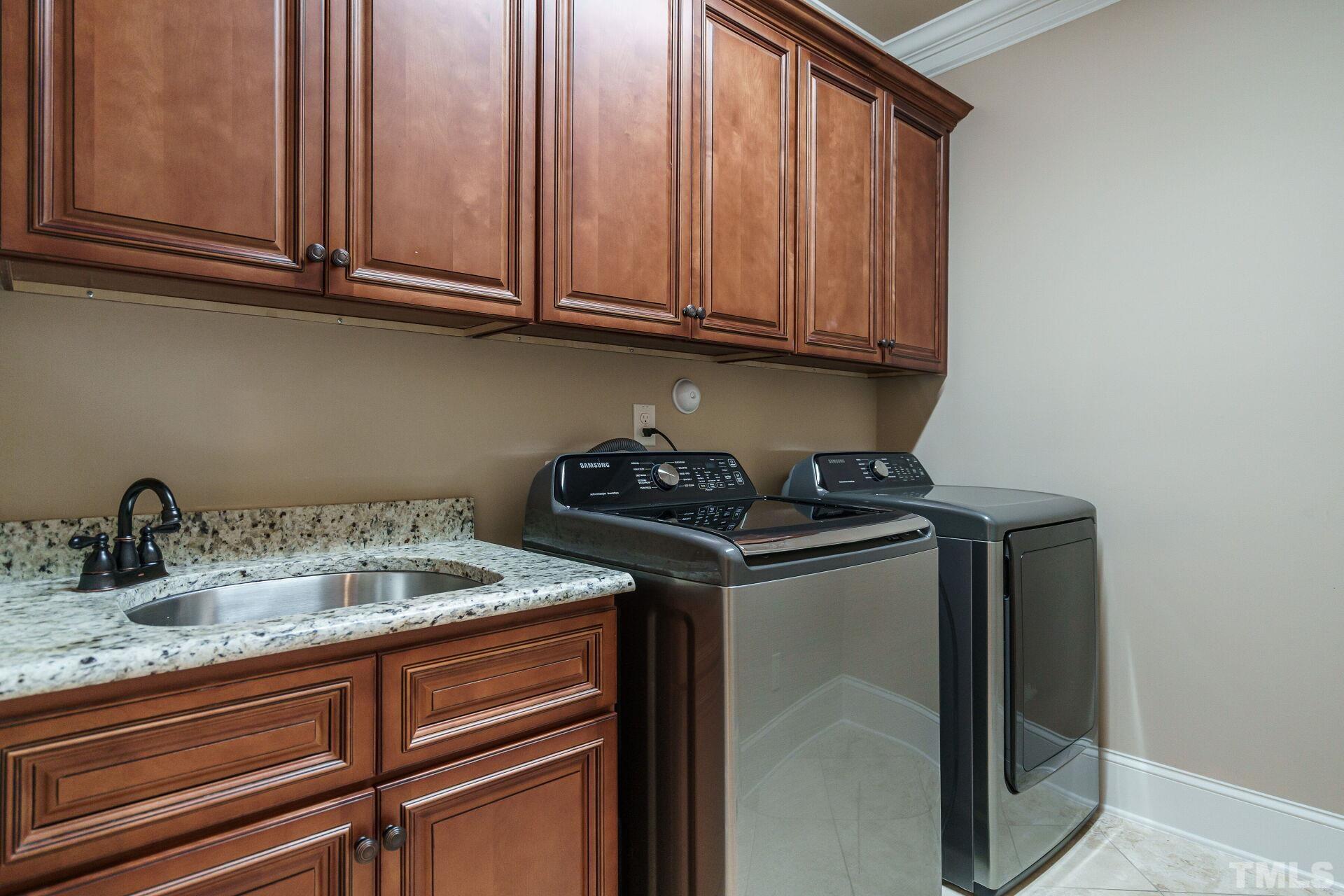 8313 Rue Cassini Court Raleigh, NC 27615 - Photo 26 of 74 a kitchen with granite countertop cabinets stainless steel appliances granite countertop a sink and dishwasher
