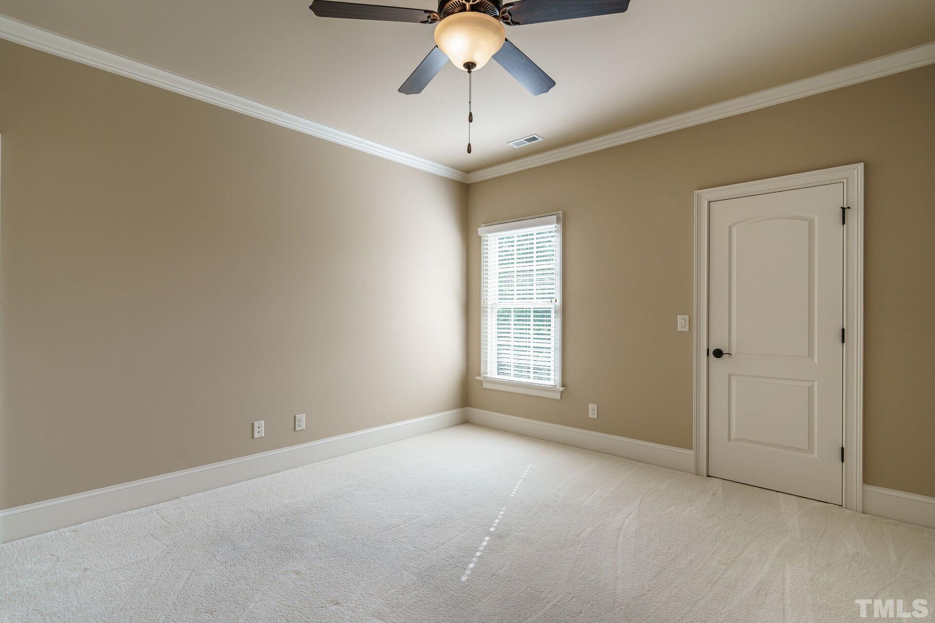 8313 Rue Cassini Court Raleigh, NC 27615 - Photo 32 of 74 a view of an empty room with a window