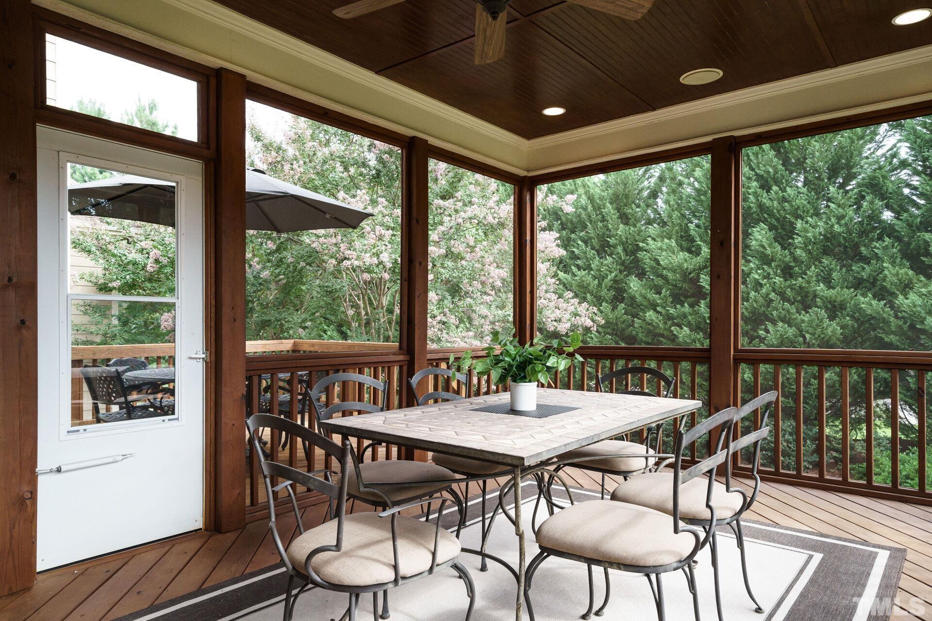 8313 Rue Cassini Court Raleigh, NC 27615 - Photo 37 of 74 a view of a dining room with furniture window and outside view
