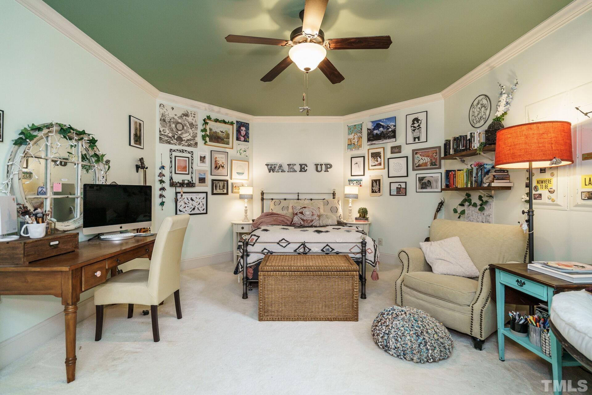 8313 Rue Cassini Court Raleigh, NC 27615 - Photo 39 of 74 a living room with furniture and a flat screen tv